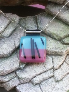 Fused Glass Pendant - Split of Turquoise Blue and Mauve w Black Design