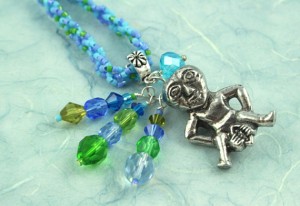 Sheela-na-gig necklace - blue and green, closeup, md