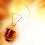 Light bulb on bright background