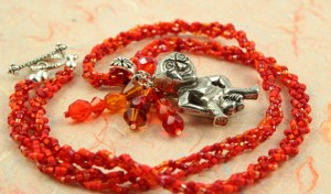 Sheela-na-gig fertility necklace, red, orange, earth, circle, md