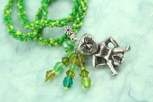 Sheela-na-gig necklace, green, closeup, md
