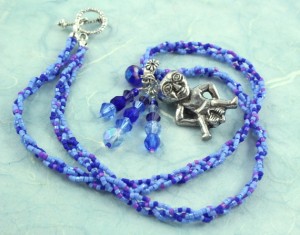 Sheela-na-gig necklace - purple and blue, circle, md