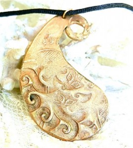 hand_forged_bronze_paisley_pendant_with_impressions_from_jade_amulet_f5ab0812