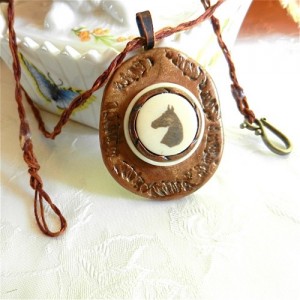 horse_head_pendant_etched_on_ivory_bakelite_set_in_bronze_polyclay_4564db29