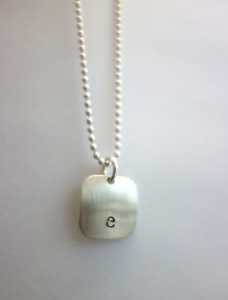 rounded square domed brushed e necklace