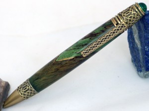 Celtic knot handcrafted wood pen in green tamarind with brass Celtic setting