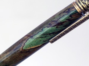 Celtic knot handcrafted wood pen in green tamarind with brass Celtic setting