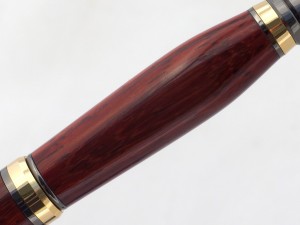 Padauk wood pen in two tone gold and gun metal setting