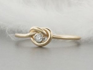unique-solid-gold-love-knot-engagement-ring-set-with-a-2mm-canadian-diamond