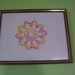 framed tatted art amusement doily in yellow and pink